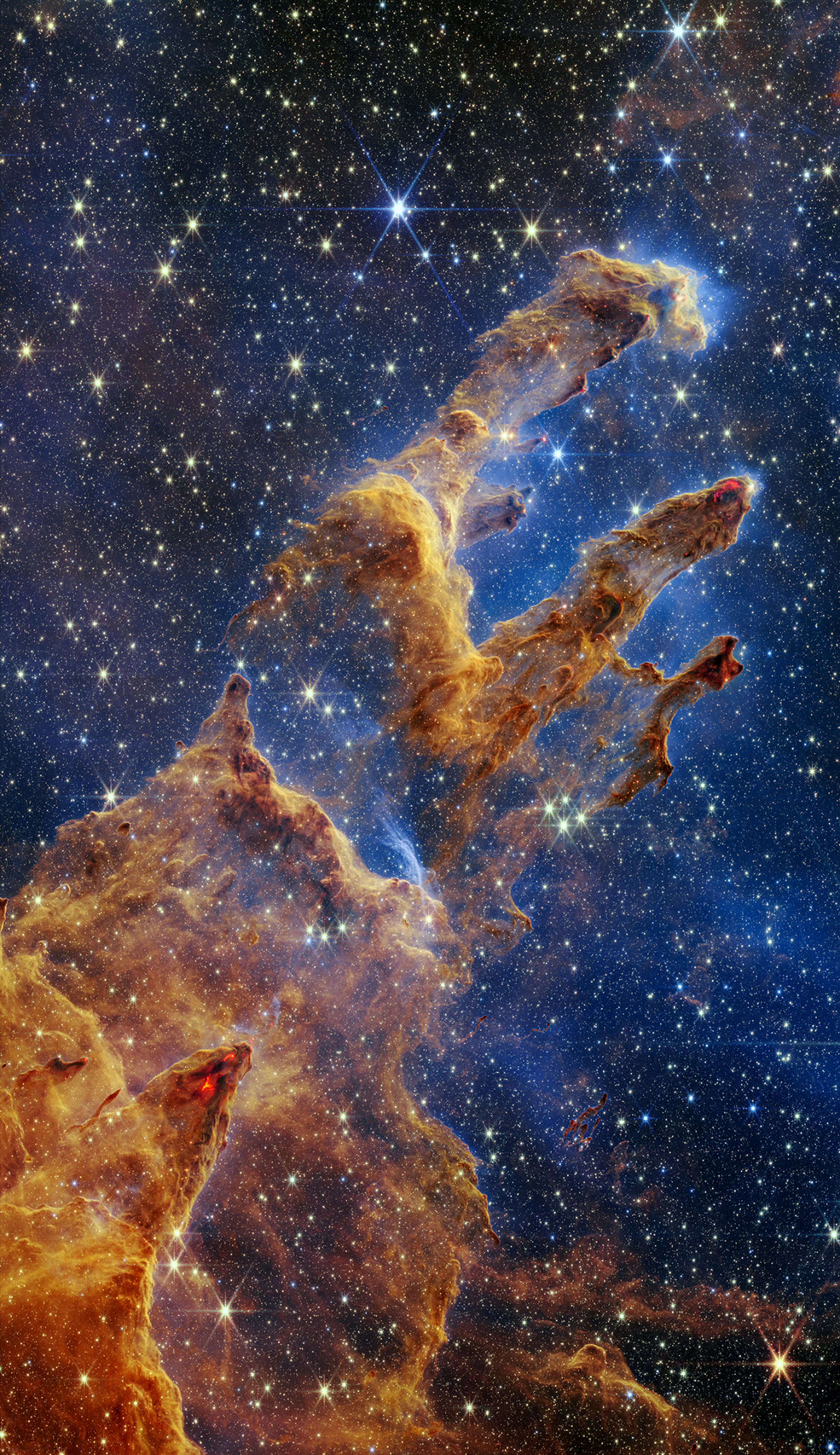 James Webb Space Telescope image of the Pillars of Creation, featuring breathtaking interstellar gas and dust clouds, a star-filled background, and iconic deep-sky structures ideal for telescope observation.