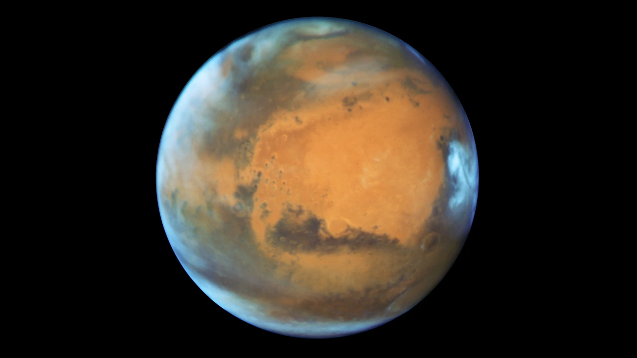 Detailed image of Mars captured by a space telescope, showcasing features like its reddish surface, making it an inspiring and perfect target for beginners using entry-level telescopes.